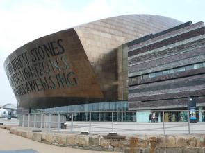 Cardiff Opera House. Inscribed on the front of the dome, above the main entrance, are two poetic lines, written by Welsh poet Gwyneth Lewis. The Welsh version is Creu Gwir fel gwydr o ffwrnais awen, which means Creating truth like glass from the furnace of inspiration. The English is In These Stones Horizons Sing. 