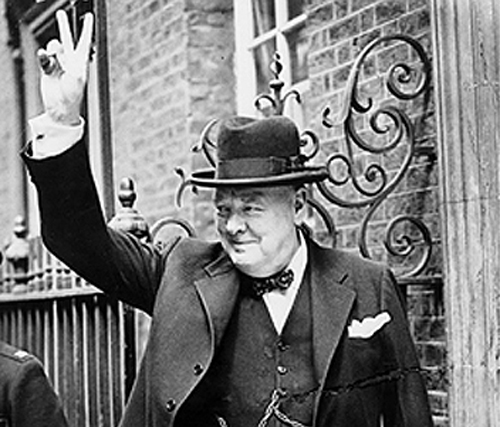 Winston Churchill giving his famous 'V' sign standing for Victory.