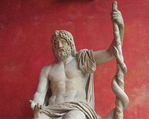 Statue of Asclepius, the Greek God of medicine, holding the symbolic Rod of Asclepius with its coiled serpent