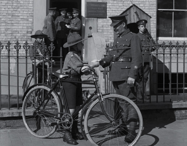 boy scout working as a military despatch cyclist during the First World War. © I WM (Q 30596)
