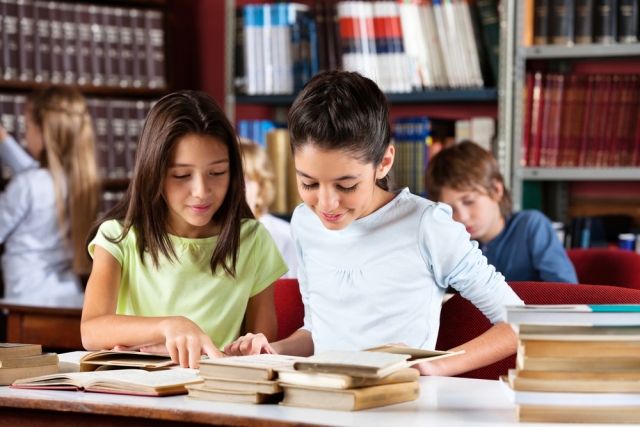 Students researching in library. Shutterstock: Image ID:158646743 Copyright: Tyler Olson