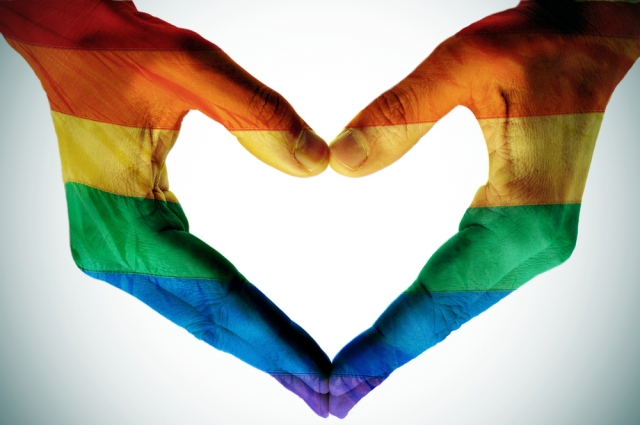 Mans hands painted as the rainbow flag forming a heart. Shutterstock Photo ID: 137191982.