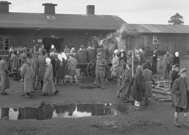 The Liberation of Bergen-Belsen Concentration Camp, April 1945: British soldiers supervise the distribution of food to camp inmates. (Imperial War Museums, photograph BU 4242 via Wikimedia Commons)