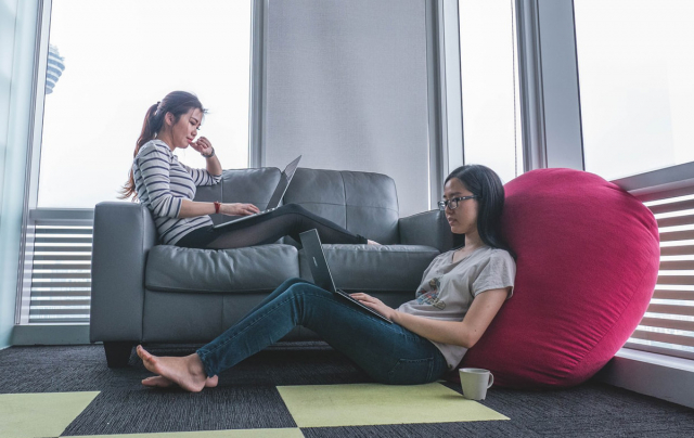 Girls working on laptops at home (Photo by Mimi Thian on Unsplash)