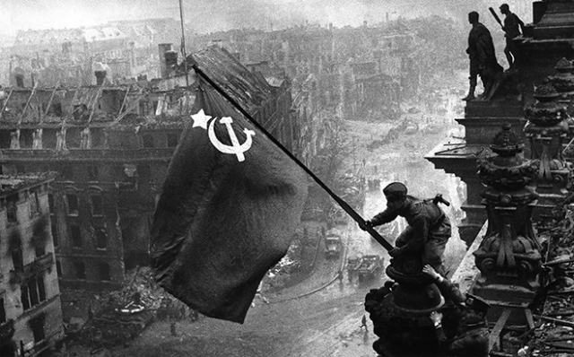 Yevgeny Khaldei’s famous photo of the Soviet flag raised over the Berlin Reichstag, 2 May 1945