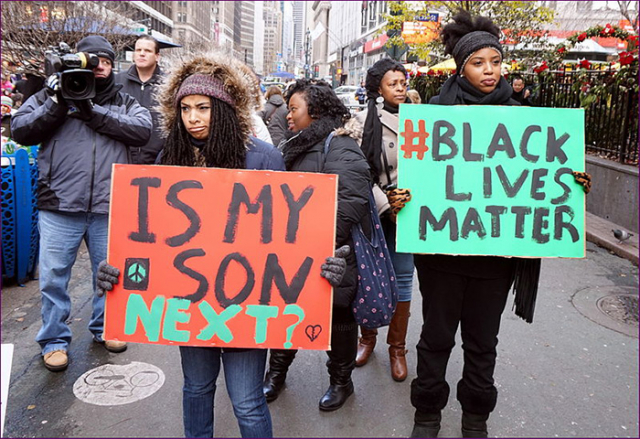 Protestors carrying placards at a Black Lives Matter demonstration in New York City (Image by The All-Nite Images, Flickr, cc-by-sa-2.0)