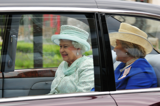 LONDON JUNE 5 - Queen Elizabeth II drives in motorcade with The Lady Farnham, on her way to Westminster during the Queens 60TH Diamond Jubilee celebrations on June 5, 2012 in London. Shutterstock Image: 104948654