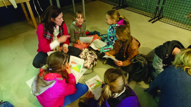 Student teacher with primary children