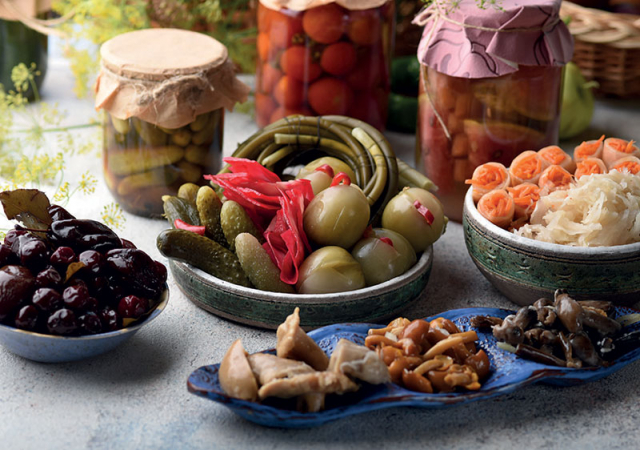 Pickled vegetables and mushrooms. Photo © Oksana Sybydlo